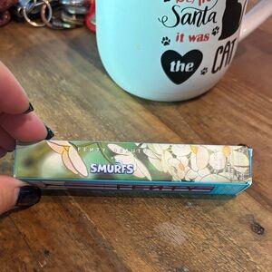Fenty Beauty Smurfs Edition Lip Product pretty flower on top of lip gloss